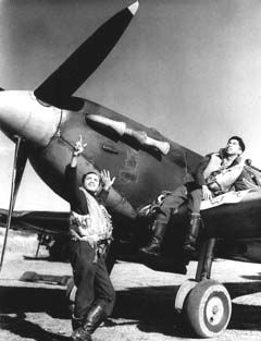 West Indian members of the RAF Bombay Squadron.  On the left is Flying Officer A.O. Weeks from Barbados and on the right Flight Sergent E.A. Joseph